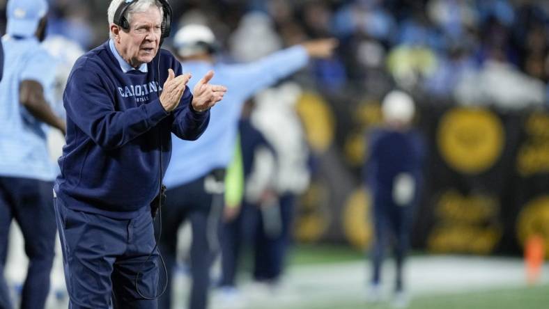 Dec 27, 2023; Charlotte, NC, USA; North Carolina Tar Heels head coach Mack Brown tries to cheer on his defense during the second half against the West Virginia Mountaineers at Bank of America Stadium. Mandatory Credit: Jim Dedmon-USA TODAY Sports