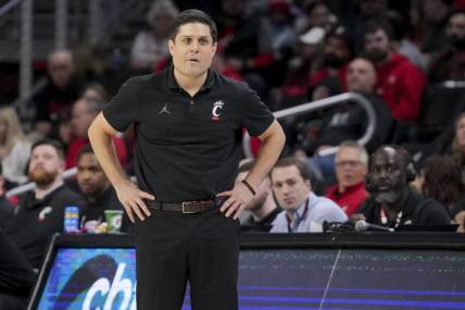 Dec 29, 2023; Cincinnati, Ohio, USA;  Cincinnati Bearcats head coach Wes Miller watches from down court in the game against the Evansville Aces in the first half at Fifth Third Arena. Mandatory Credit: Aaron Doster-USA TODAY Sports