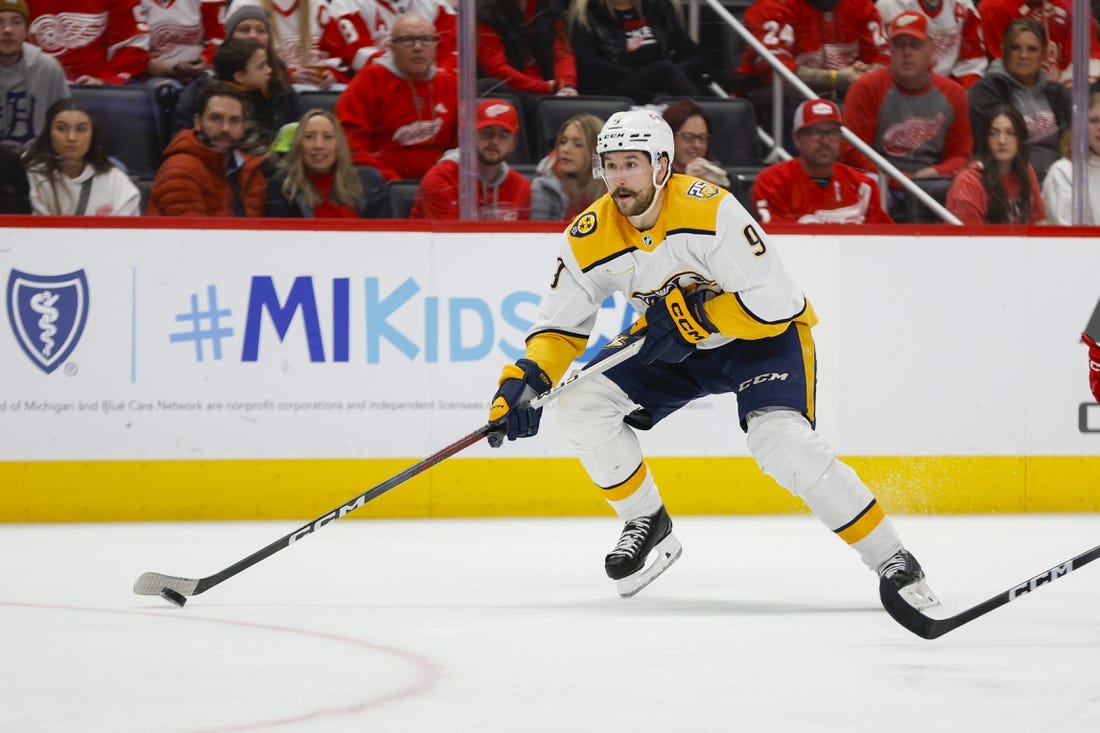 Dec 29, 2023; Detroit, Michigan, USA; Nashville Predators left wing Filip Forsberg (9) handles the puck during the third period of the game between the Detroit Red Wings and the Nashville Predators at Little Caesars Arena. Mandatory Credit: Brian Bradshaw Sevald-USA TODAY Sports