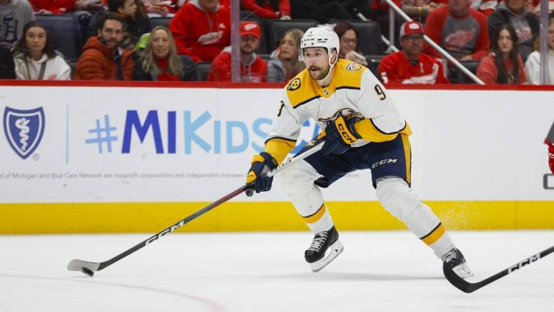 Dec 29, 2023; Detroit, Michigan, USA; Nashville Predators left wing Filip Forsberg (9) handles the puck during the third period of the game between the Detroit Red Wings and the Nashville Predators at Little Caesars Arena. Mandatory Credit: Brian Bradshaw Sevald-USA TODAY Sports