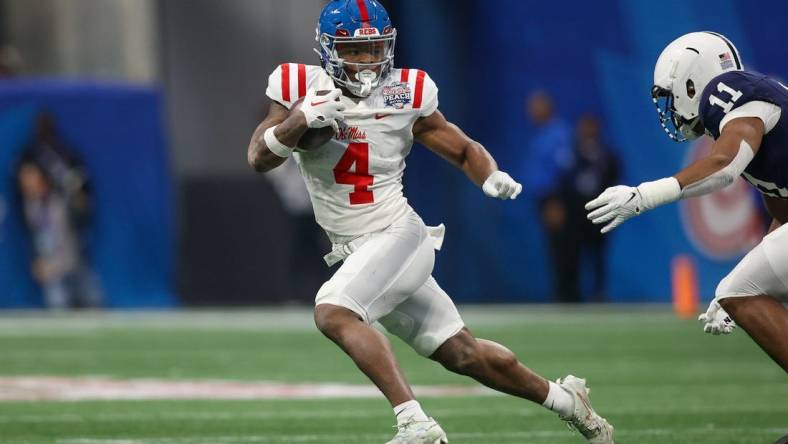 Dec 30, 2023; Atlanta, GA, USA; Mississippi Rebels running back Quinshon Judkins (4) runs the ball against the Penn State Nittany Lions in the first quarter at Mercedes-Benz Stadium. Mandatory Credit: Brett Davis-USA TODAY Sports