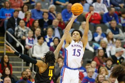 Kansas graduate senior guard Kevin McCullar Jr. (15) shoots for three against Wichita State during the second half of Saturday's game inside T-Mobile Center in Kansas City.