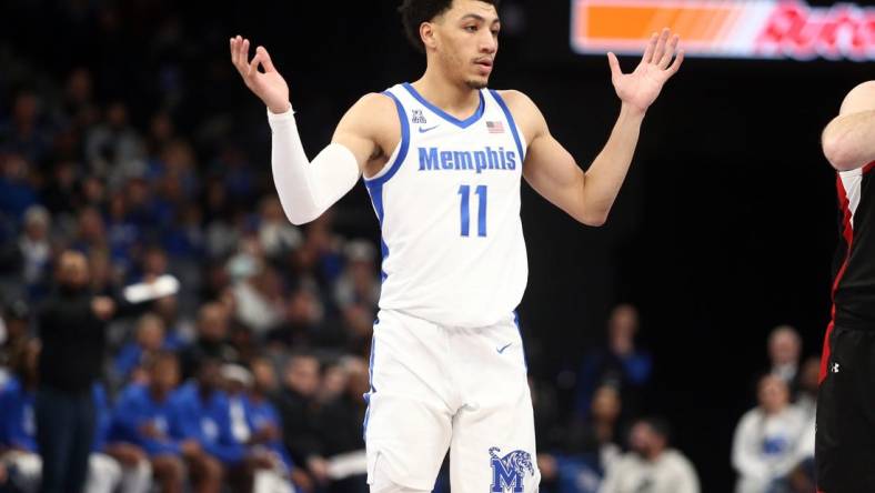 Dec 30, 2023; Memphis, Tennessee, USA; Memphis Tigers guard Jahvon Quinerly (11) reacts during the second half against the Austin Peay Governors at FedExForum. Mandatory Credit: Petre Thomas-USA TODAY Sports