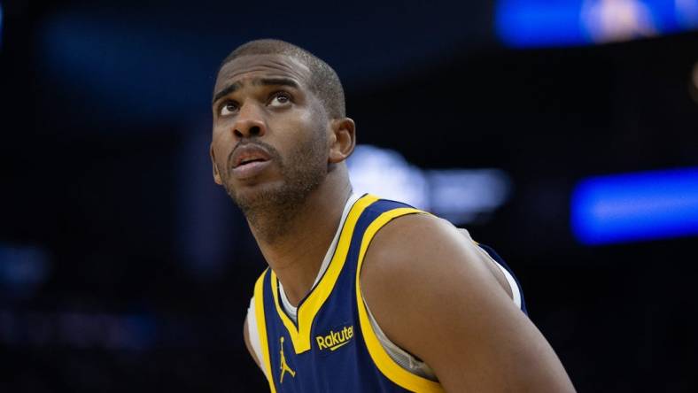 Dec 30, 2023; San Francisco, California, USA; Golden State Warriors guard Chris Paul (3) checks the scoreboard during the fourth quarter against the Dallas Mavericks at Chase Center. Mandatory Credit: D. Ross Cameron-USA TODAY Sports