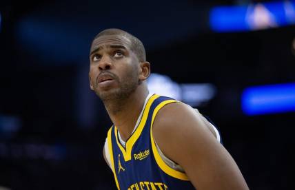 Dec 30, 2023; San Francisco, California, USA; Golden State Warriors guard Chris Paul (3) checks the scoreboard during the fourth quarter against the Dallas Mavericks at Chase Center. Mandatory Credit: D. Ross Cameron-USA TODAY Sports