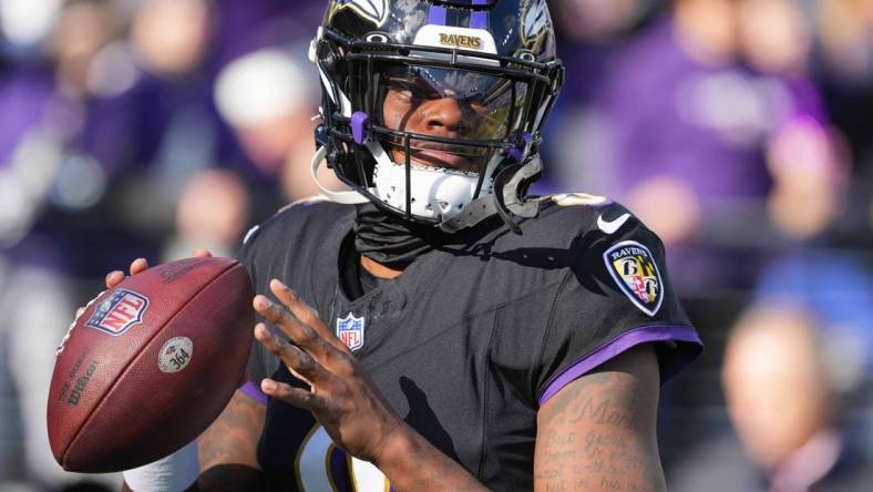 Dec 31, 2023; Baltimore, Maryland, USA; Baltimore Ravens  quarterback Lamar Jackson (8) warms up prior to the game against the Miami Dolphins at M&T Bank Stadium. Mandatory Credit: Mitch Stringer-USA TODAY Sports