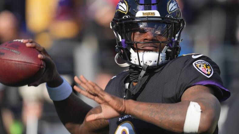 Dec 31, 2023; Baltimore, Maryland, USA; Baltimore Ravens  quarterback Lamar Jackson (8) warms up prior to the game against the Miami Dolphins at M&T Bank Stadium. Mandatory Credit: Mitch Stringer-USA TODAY Sports