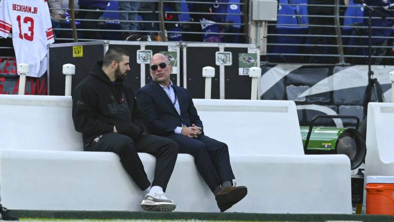 Dec 31, 2023; Baltimore, Maryland, USA; Baltimore Ravens general manager Eric DeCosta speaks with tight end Mark Andrews on the sidelines before the game against the Miami Dolphins  at M&T Bank Stadium. Mandatory Credit: Tommy Gilligan-USA TODAY Sports