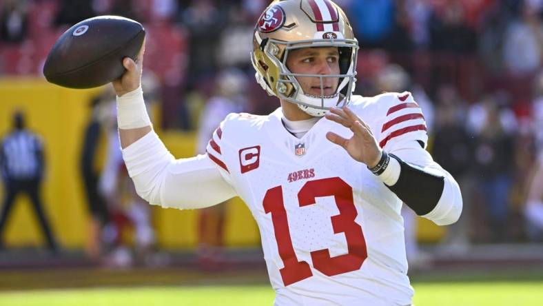 Dec 31, 2023; Landover, Maryland, USA; San Francisco 49ers quarterback Brock Purdy (13) warms up  before the game against the Washington Commanders at FedExField. Mandatory Credit: Brad Mills-USA TODAY Sports