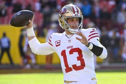 Dec 31, 2023; Landover, Maryland, USA; San Francisco 49ers quarterback Brock Purdy (13) warms up  before the game against the Washington Commanders at FedExField. Mandatory Credit: Brad Mills-USA TODAY Sports