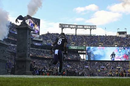 Dec 31, 2023; Baltimore, Maryland, USA;  Baltimore Ravens quarterback Lamar Jackson (8) enters the field before the game against the Miami Dolphins at M&T Bank Stadium. Mandatory Credit: Tommy Gilligan-USA TODAY Sports