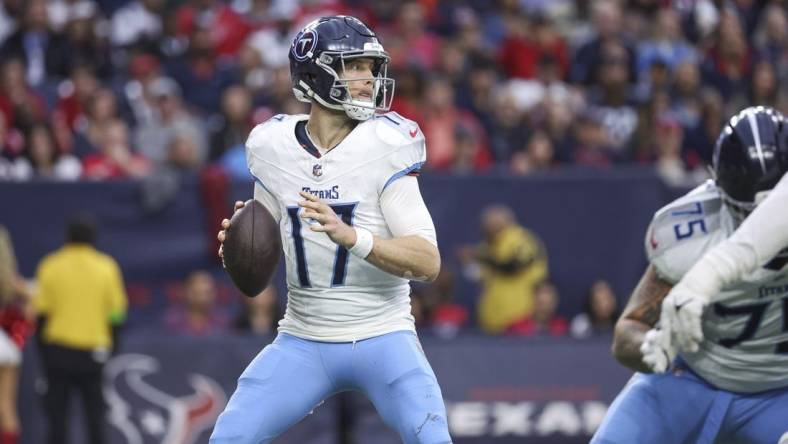 Dec 31, 2023; Houston, Texas, USA; Tennessee Titans quarterback Ryan Tannehill (17) looks for an open receiver during the fourth quarter against the Houston Texans at NRG Stadium. Mandatory Credit: Troy Taormina-USA TODAY Sports