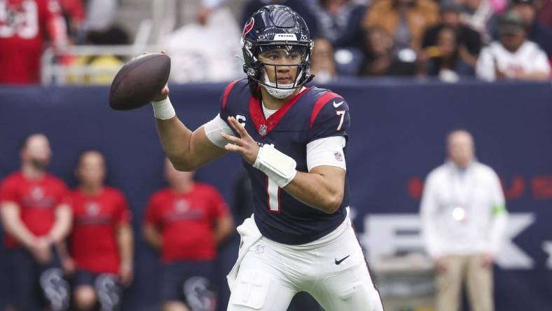 Dec 31, 2023; Houston, Texas, USA; Houston Texans quarterback C.J. Stroud (7) attempts a pass during the third quarter against the Tennessee Titans at NRG Stadium. Mandatory Credit: Troy Taormina-USA TODAY Sports