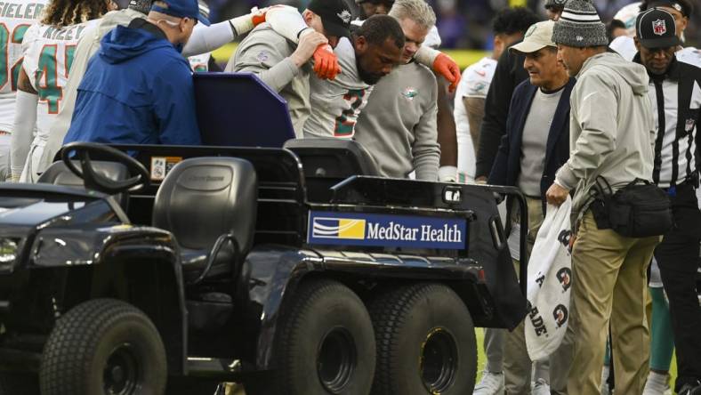 Dec 31, 2023; Baltimore, Maryland, USA;  Miami Dolphins linebacker Bradley Chubb (2) ins helped to the cart after being injured during the second  half against the Baltimore Ravens at M&T Bank Stadium.Baltimore Ravens defeated Miami Dolphins 56-19. Mandatory Credit: Tommy Gilligan-USA TODAY Sports