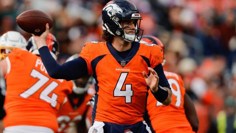 Dec 31, 2023; Denver, Colorado, USA; Denver Broncos quarterback Jarrett Stidham (4) attempts a pass in the first quarter against the Los Angeles Chargers at Empower Field at Mile High. Mandatory Credit: Isaiah J. Downing-USA TODAY Sports