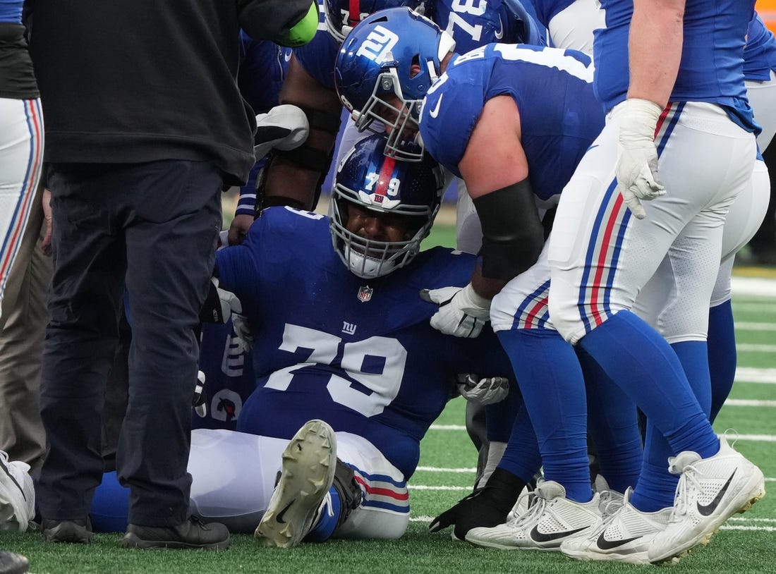 East Rutherford, NJ, Dec. 31, 2023 -- Right tackle Tyre Phillips of the Giants had to be carted off the field in the second half.