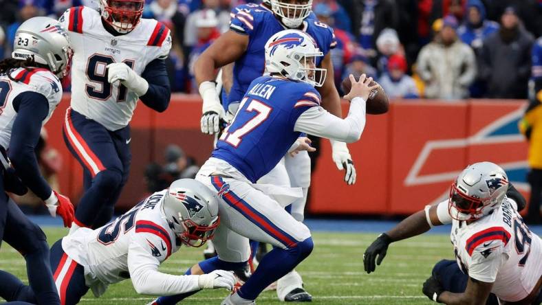 Buffalo Bills quarterback Josh Allen (17) is tackled after scrambling out of the pocket.