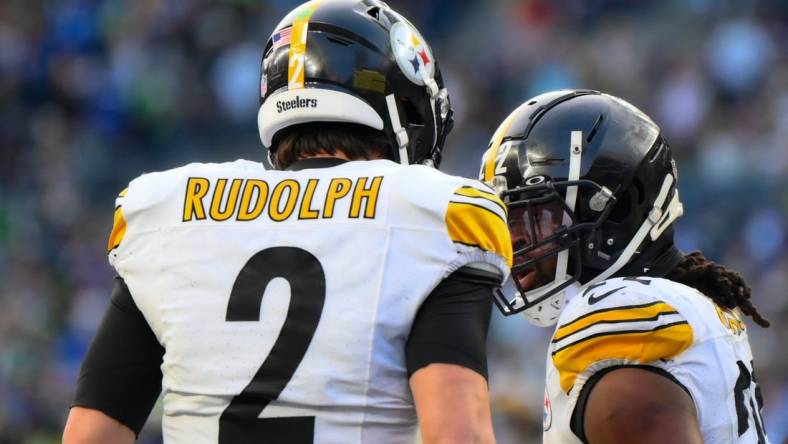 Dec 31, 2023; Seattle, Washington, USA; Pittsburgh Steelers quarterback Mason Rudolph (2) and running back Najee Harris (22) celebrate after Harris scored a touchdown against the Seattle Seahawks during the second half at Lumen Field. Mandatory Credit: Steven Bisig-USA TODAY Sports