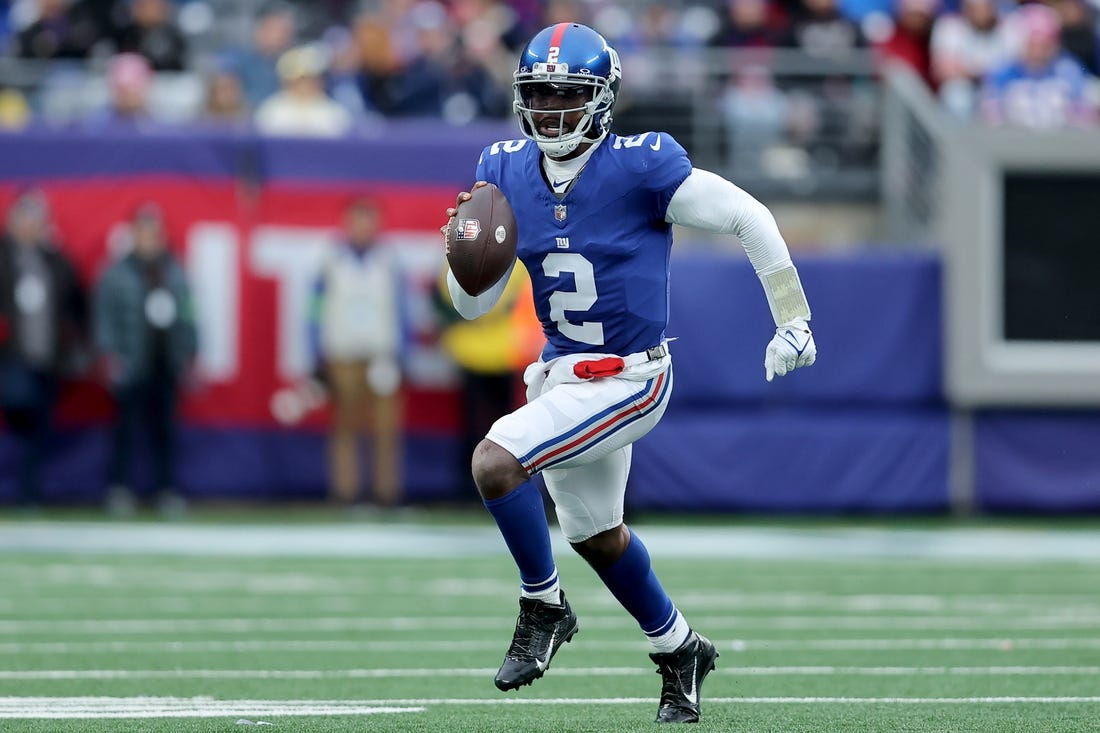 Dec 31, 2023; East Rutherford, New Jersey, USA; New York Giants quarterback Tyrod Taylor (2) runs with the ball against the Los Angeles Rams during the third quarter at MetLife Stadium. Mandatory Credit: Brad Penner-USA TODAY Sports