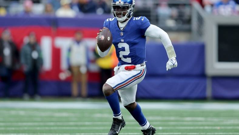 Dec 31, 2023; East Rutherford, New Jersey, USA; New York Giants quarterback Tyrod Taylor (2) runs with the ball against the Los Angeles Rams during the third quarter at MetLife Stadium. Mandatory Credit: Brad Penner-USA TODAY Sports