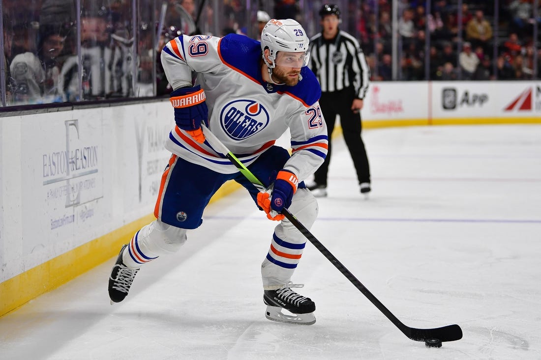 Dec 31, 2023; Anaheim, California, USA; Edmonton Oilers center Leon Draisaitl (29) moves the puck against the Anaheim Ducks during the third period at Honda Center. Mandatory Credit: Gary A. Vasquez-USA TODAY Sports