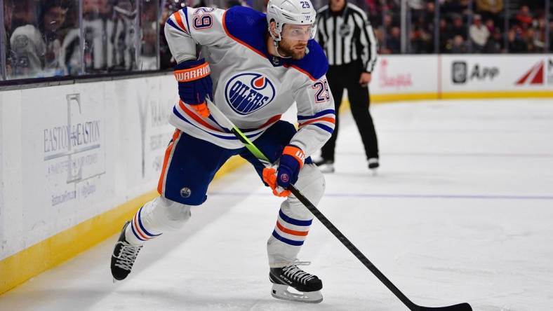 Dec 31, 2023; Anaheim, California, USA; Edmonton Oilers center Leon Draisaitl (29) moves the puck against the Anaheim Ducks during the third period at Honda Center. Mandatory Credit: Gary A. Vasquez-USA TODAY Sports