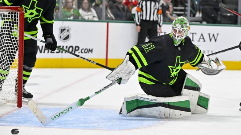 Dec 31, 2023; Dallas, Texas, USA; Dallas Stars goaltender Scott Wedgewood (41) makes a stick save against the Chicago Blackhawks during the third period at the American Airlines Center. Mandatory Credit: Jerome Miron-USA TODAY Sports