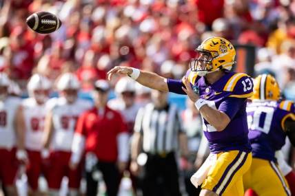 Jan 1, 2024; Tampa, FL, USA; LSU Tigers quarterback Garrett Nussmeier (13) throws the ball during the first half against the Wisconsin Badgers at Raymond James Stadium. Mandatory Credit: Matt Pendleton-USA TODAY Sports