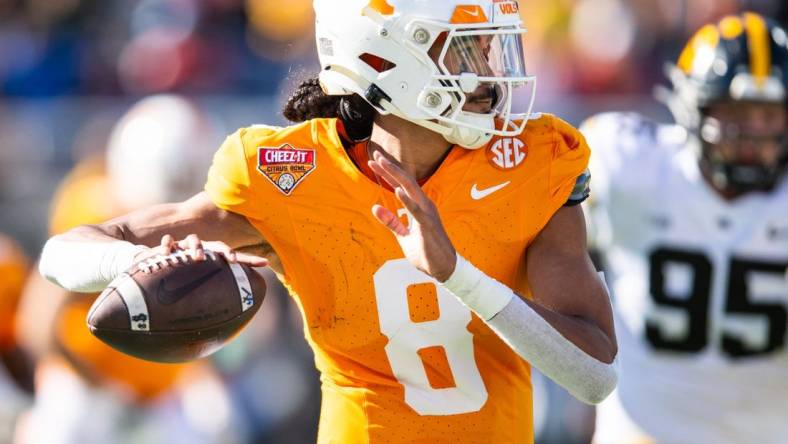 Jan 1, 2024; Orlando, FL, USA; Tennessee Volunteers quarterback Nico Iamaleava (8) throws the ball against the Iowa Hawkeyes in the second quarter at Camping World Stadium. Mandatory Credit: Jeremy Reper-USA TODAY Sports