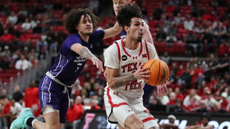 Jan 1, 2024; Lubbock, Texas, USA; Texas Tech Red Raiders guard Pop Isaacs (2) stops to take a shot against  North Alabama Lions guard KJ Johnson (3) in the first half  at United Supermarkets Arena. Mandatory Credit: Michael C. Johnson-USA TODAY Sports