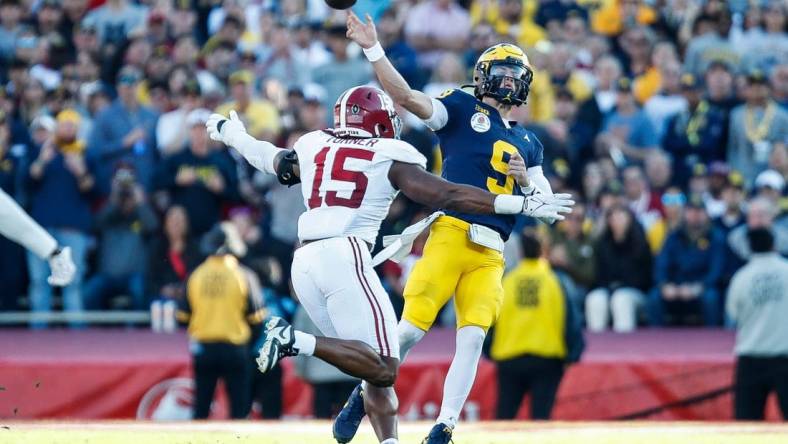 Michigan quarterback J.J. McCarthy makes a pass against Alabama linebacker Dallas Turner during the first half of the Rose Bowl in Pasadena, California, on Monday, Jan. 1, 2024.