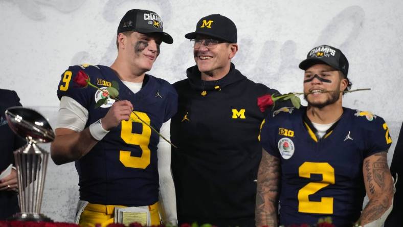 Jan 1, 2024; Pasadena, CA, USA; Michigan Wolverines head coach Jim Harbaugh (center) celebrates with quarterback J.J. McCarthy (9) and running back Blake Corum (2) after defeating the Alabama Crimson Tide in the 2024 Rose Bowl college football playoff semifinal game at Rose Bowl. Mandatory Credit: Kirby Lee-USA TODAY Sports