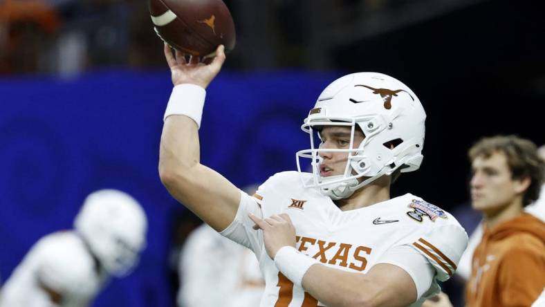 Jan 1, 2024; New Orleans, LA, USA; Texas Longhorns quarterback Arch Manning (16) warms up before the 2024 Sugar Bowl college football playoff semifinal game against the Washington Huskies at Caesars Superdome. Mandatory Credit: Geoff Burke-USA TODAY Sports