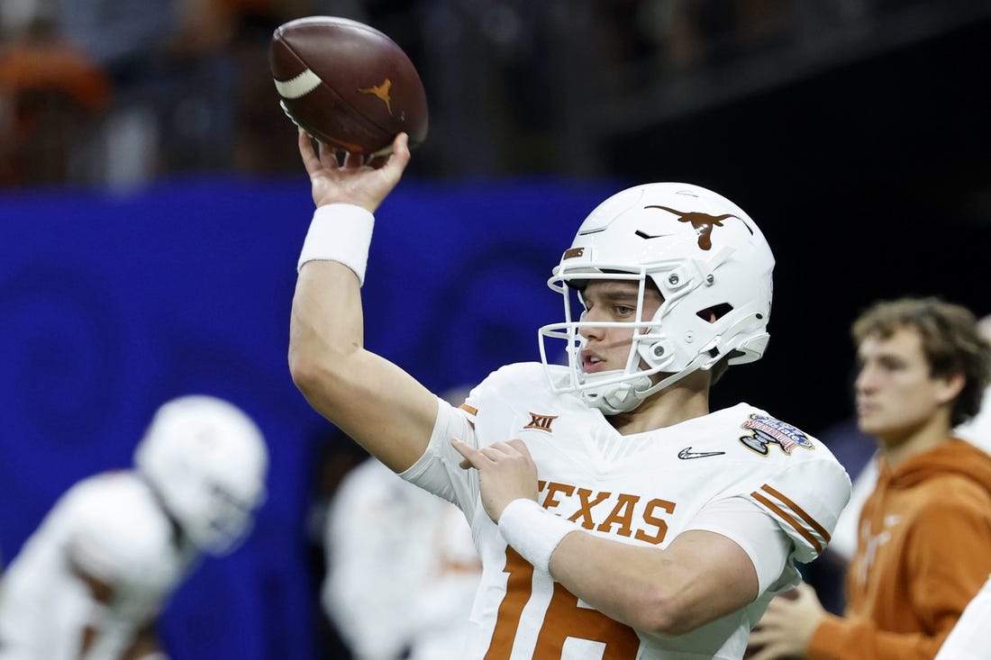 Jan 1, 2024; New Orleans, LA, USA; Texas Longhorns quarterback Arch Manning (16) warms up before the 2024 Sugar Bowl college football playoff semifinal game against the Washington Huskies at Caesars Superdome. Mandatory Credit: Geoff Burke-USA TODAY Sports