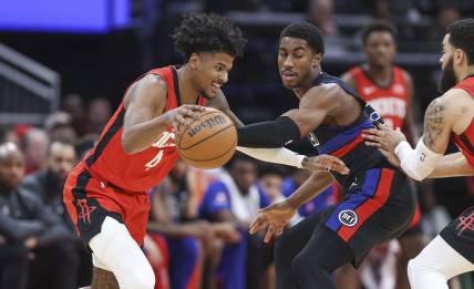 Jan 1, 2024; Houston, Texas, USA; Houston Rockets guard Jalen Green (4) controls the ball as Detroit Pistons guard Jaden Ivey (23) defends during the second quarter at Toyota Center. Mandatory Credit: Troy Taormina-USA TODAY Sports