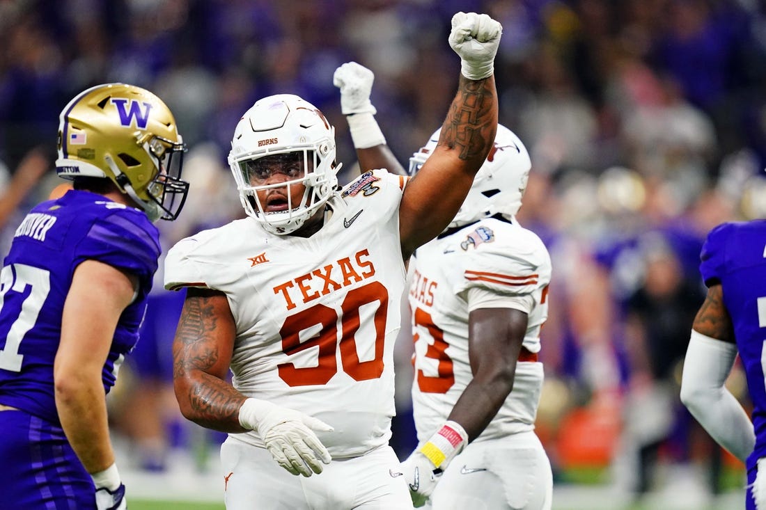 Jan 1, 2024; New Orleans, LA, USA; Texas Longhorns defensive lineman Byron Murphy II (90) celebrates after a play during the second quarter  in the 2024 Sugar Bowl college football playoff semifinal game at Caesars Superdome. Mandatory Credit: John David Mercer-USA TODAY Sports