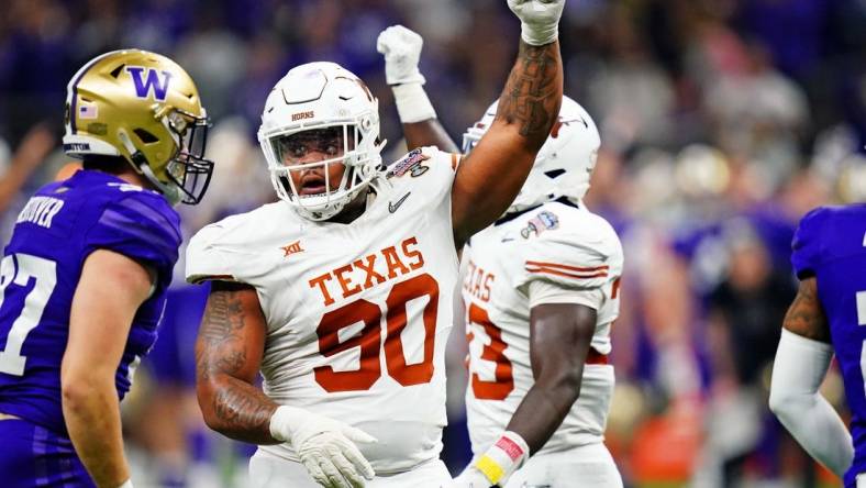 Jan 1, 2024; New Orleans, LA, USA; Texas Longhorns defensive lineman Byron Murphy II (90) celebrates after a play during the second quarter  in the 2024 Sugar Bowl college football playoff semifinal game at Caesars Superdome. Mandatory Credit: John David Mercer-USA TODAY Sports