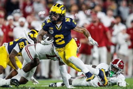 Michigan running back Blake Corum (2) runs against Alabama during the second half of the Rose Bowl in Pasadena, Calif., on Monday, Jan. 1, 2024.