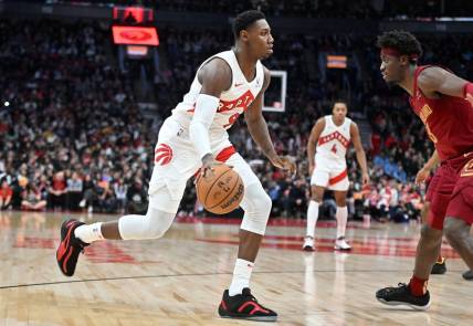 Jan 1, 2024; Toronto, Ontario, CAN;  Toronto Raptors forward RJ Barrett (9) dribbles the ball up court against the Cleveland Cavaliers in the second half at Scotiabank Arena. Mandatory Credit: Dan Hamilton-USA TODAY Sports