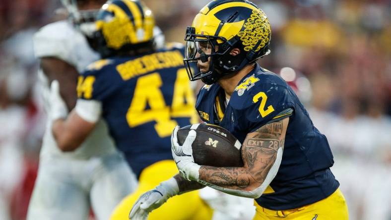 Michigan running back Blake Corum (2) runs against Alabama during the second half of the Rose Bowl in Pasadena, Calif., on Monday, Jan. 1, 2024.