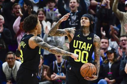 Jan 1, 2024; Salt Lake City, Utah, USA; Utah Jazz guard Jordan Clarkson (00) reacts after recovering a rebound for a record breaking triple-double against the Dallas Mavericks during the second half at the Delta Center. Mandatory Credit: Christopher Creveling-USA TODAY Sports