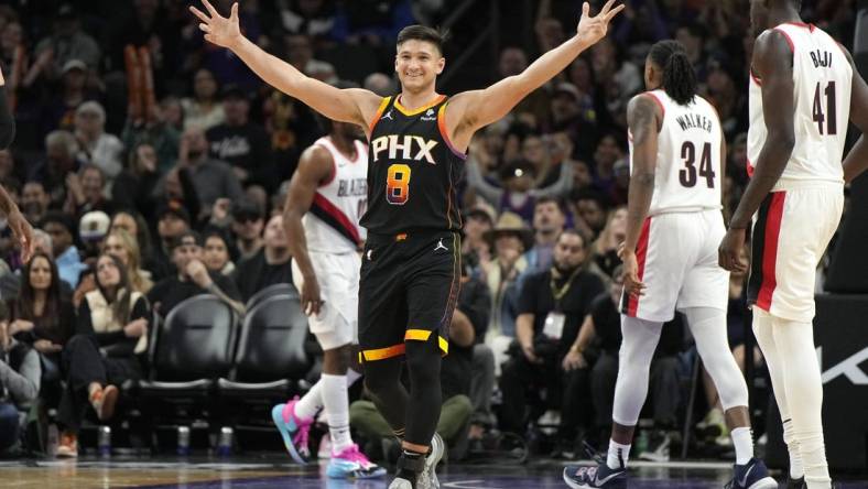 Jan 1, 2024; Phoenix, Arizona, USA; Phoenix Suns guard Grayson Allen (8) reacts after guard Devin Booker (1) makes a basket against the Portland Trail Blazers in the second half at Footprint Center. Mandatory Credit: Rick Scuteri-USA TODAY Sports