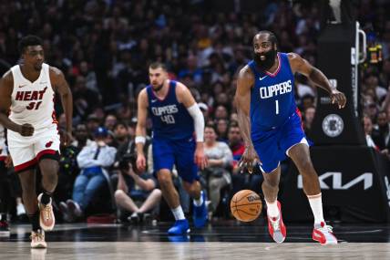 Jan 1, 2024; Los Angeles, California, USA; Los Angeles Clippers guard James Harden (1) moves the ball against Miami Heat center Thomas Bryant (31) during the second quarter at Crypto.com Arena. Mandatory Credit: Jonathan Hui-USA TODAY Sports