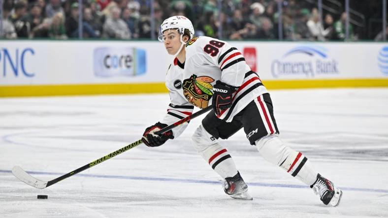 Dec 31, 2023; Dallas, Texas, USA; Chicago Blackhawks center Connor Bedard (98) in action during the game between the Dallas Stars and the Chicago Blackhawks at the American Airlines Center. Mandatory Credit: Jerome Miron-USA TODAY Sports