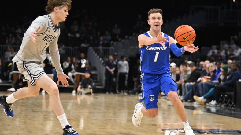 Jan 2, 2024; Washington, District of Columbia, USA; Creighton Bluejays guard Steven Ashworth (1) passes the ball as Georgetown Hoyas guard Rowan Brumbaugh (1) looks on during the first half at Capital One Arena. Mandatory Credit: Brad Mills-USA TODAY Sports