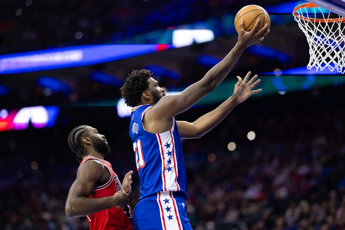 Jan 2, 2024; Philadelphia, Pennsylvania, USA; Philadelphia 76ers center Joel Embiid (21) drives for a score past Chicago Bulls forward Patrick Williams (44) during the second quarter at Wells Fargo Center. Mandatory Credit: Bill Streicher-USA TODAY Sports