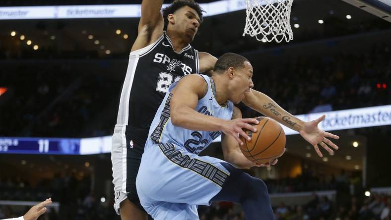 Jan 2, 2024; Memphis, Tennessee, USA; Memphis Grizzlies guard Desmond Bane (22) passes the ball as San Antonio Spurs forward Dominick Barlow (26) defends during the first half at FedExForum. Mandatory Credit: Petre Thomas-USA TODAY Sports