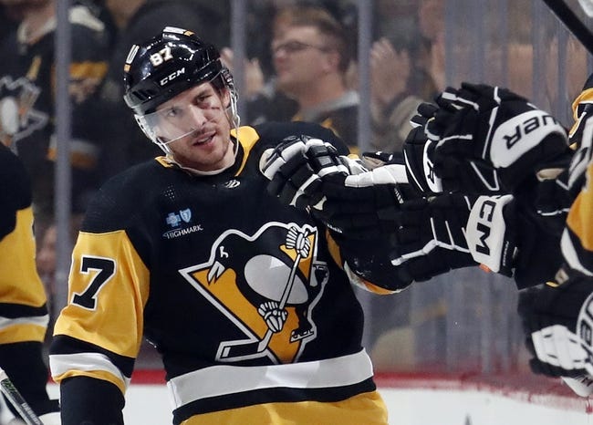 Jan 2, 2024; Pittsburgh, Pennsylvania, USA;  Pittsburgh Penguins center Sidney Crosby (87) celebrates with the Pens bench after scoring a power play goal against the Washington Capitals during the second period at PPG Paints Arena. Mandatory Credit: Charles LeClaire-USA TODAY Sports