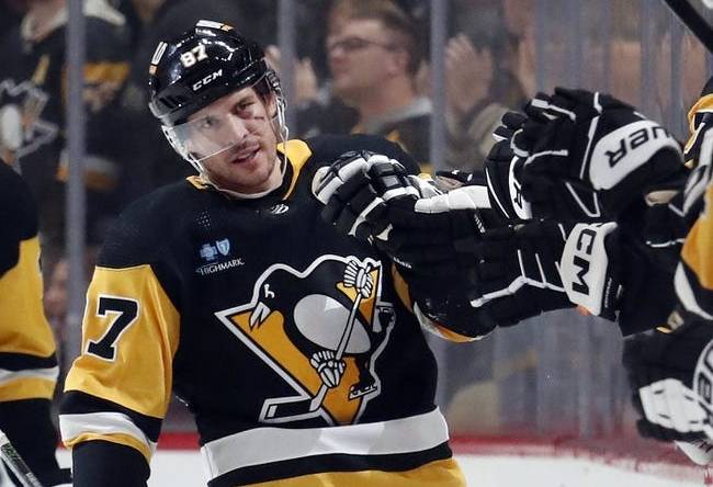 Jan 2, 2024; Pittsburgh, Pennsylvania, USA;  Pittsburgh Penguins center Sidney Crosby (87) celebrates with the Pens bench after scoring a power play goal against the Washington Capitals during the second period at PPG Paints Arena. Mandatory Credit: Charles LeClaire-USA TODAY Sports