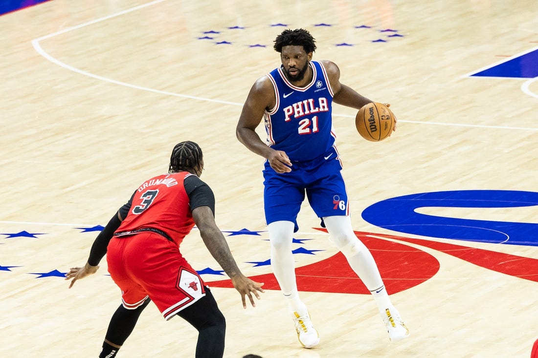 Jan 2, 2024; Philadelphia, Pennsylvania, USA; Philadelphia 76ers center Joel Embiid (21) controls the ball against Chicago Bulls center Andre Drummond (3) during the third quarter at Wells Fargo Center. Mandatory Credit: Bill Streicher-USA TODAY Sports